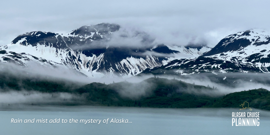 Moody skies with mist and rain in Alaska’s Inside Passage — a typical scene that highlights why smart Alaska cruise weather packing is essential.