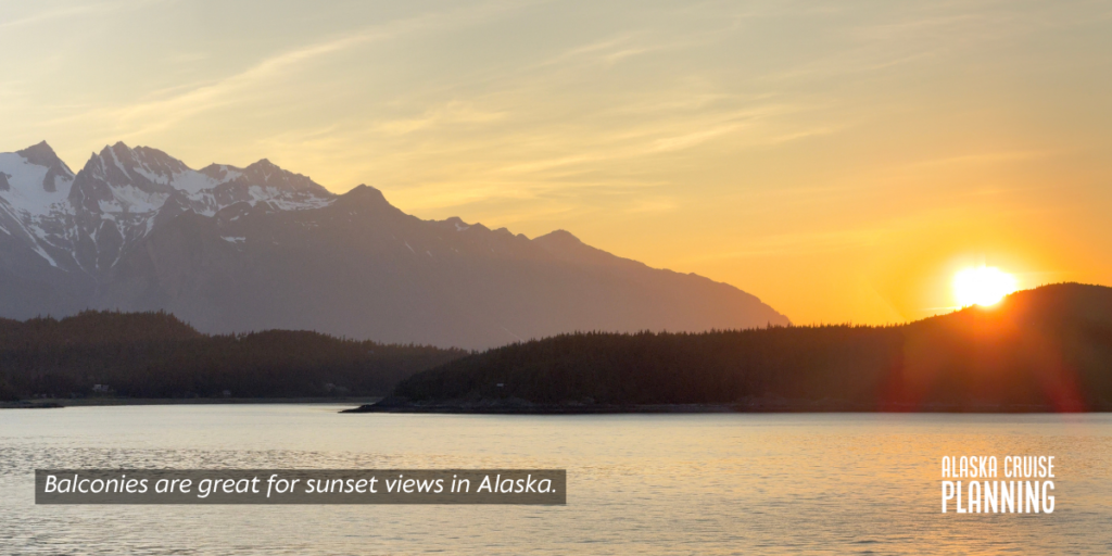 Balcony view of a glowing Alaska sunset, showing why early booking gets you the best staterooms at the best price.